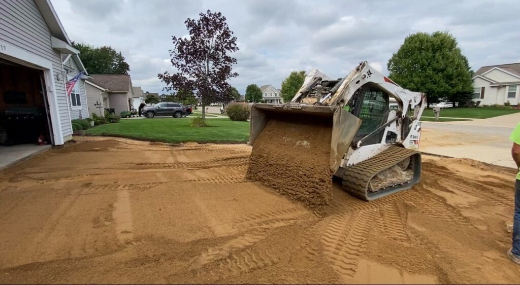 The Kent Home Services team adds new base for a 1,400-square-foot concrete driveway