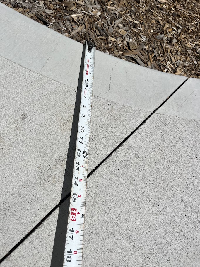 Checking uneven concrete elevation during a structural alignment inspection