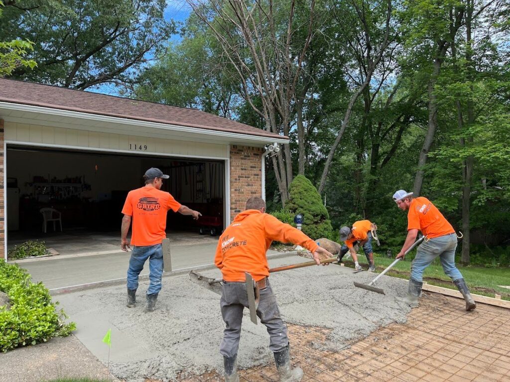 Kent Home Services crew installing a new concrete driveway at a residential home