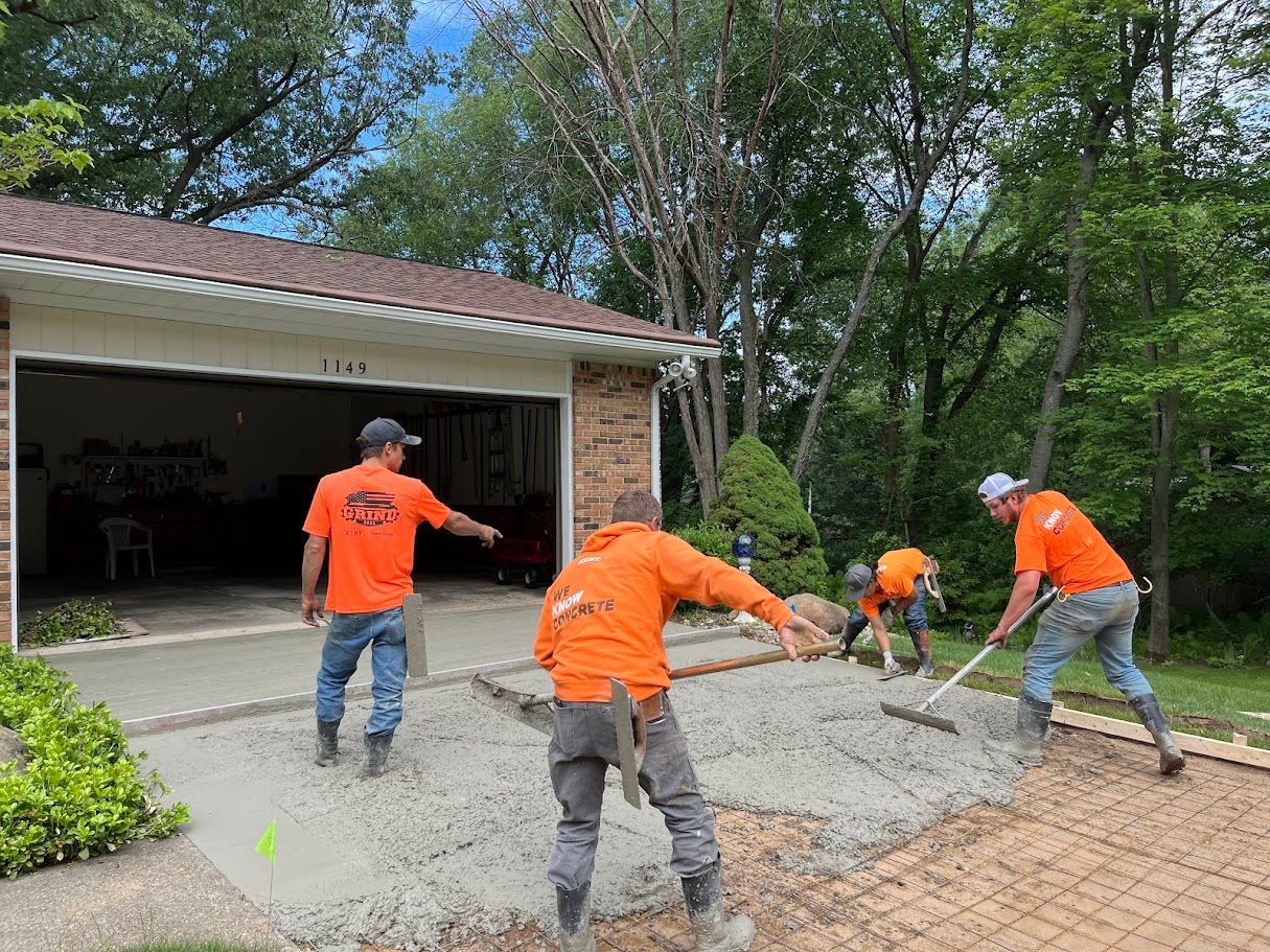 Kent Home Services crew installing a new concrete driveway at a residential home